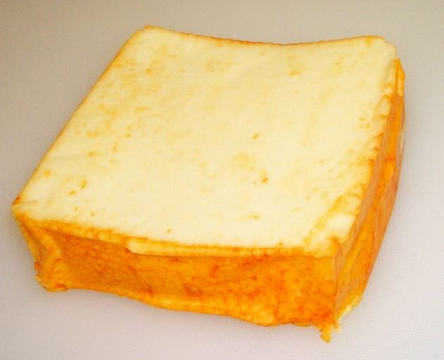 a block of Muenster cheese