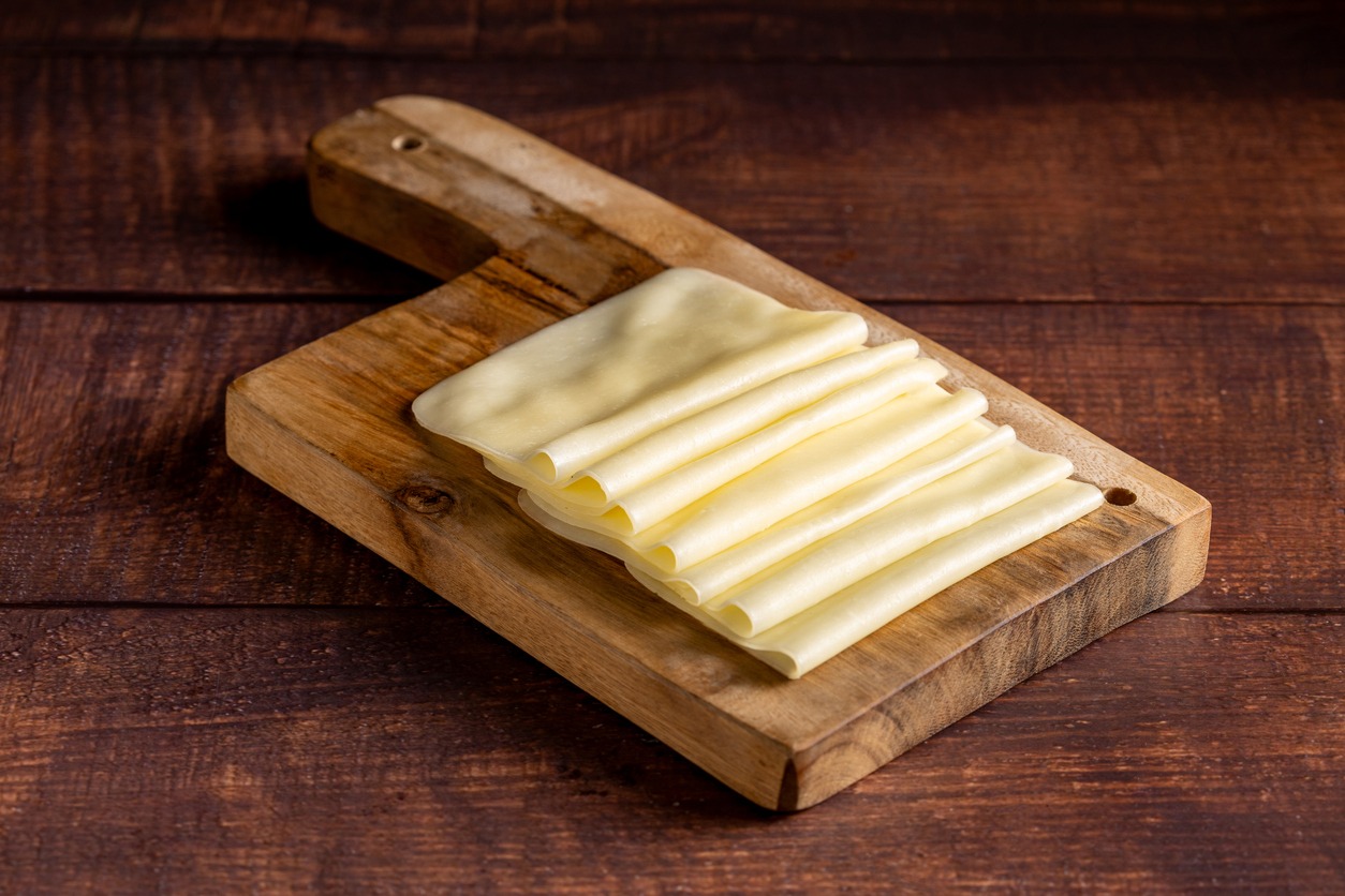 Cheese slices. Portion of sliced mozzarella cheese.