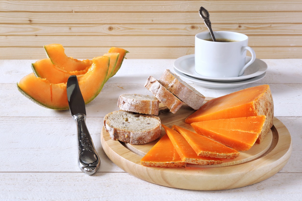 mimolette cheese, bread, coffee and melon