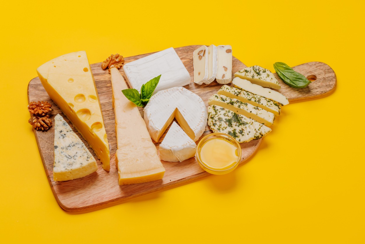 An assortment of various cheeses arranged on a board