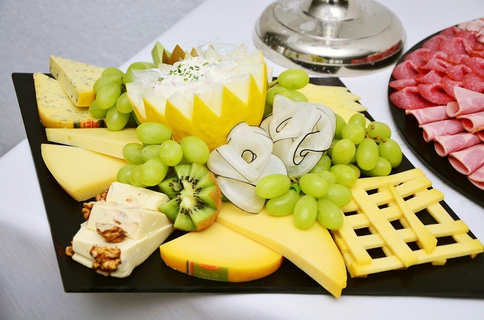 cheese plate with fruits for a party
