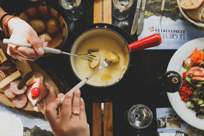 dipping potatoes in cheese fondue